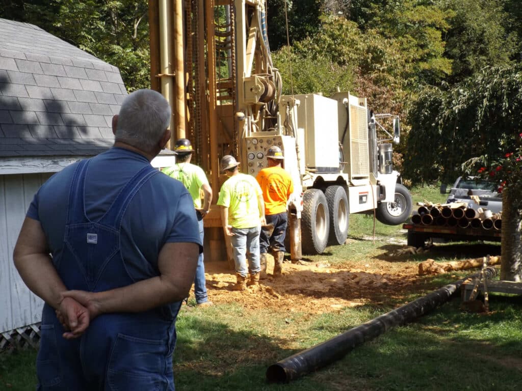 Grant Gibson watches as a big rig team contracted by the Jubilee Water Project digs his well. PHOTO: JUBILEE PROJECT