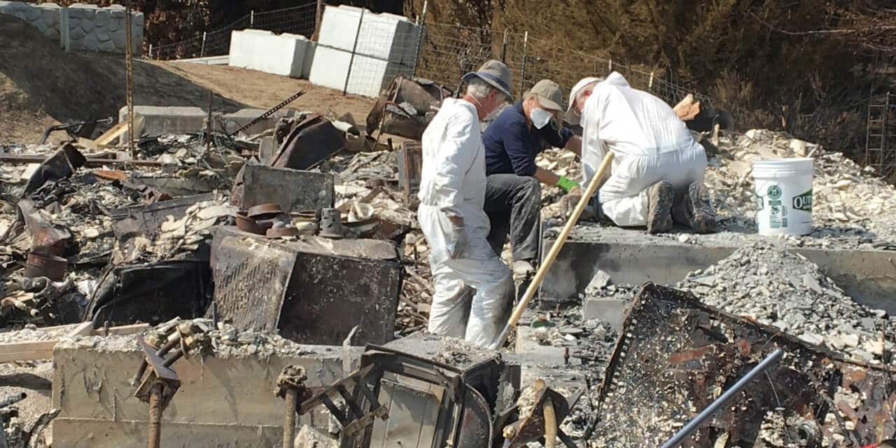 A California-Nevada Conference volunteer teams sifts through the ashes of a survivor’s former home at the survivor's request. (Photo: (Photo: Courtesy of the California-Nevada Conference CDRC)
