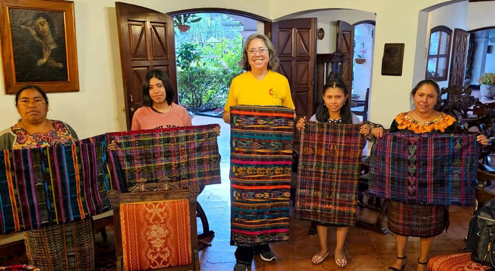 Lulu Ramirez (center) with a Quiche women's cooperative participating in the Guatemalan Methodist Church's microloan program to make traditional cloth for women. (Photo: Courtesy of L. Ramirez)
