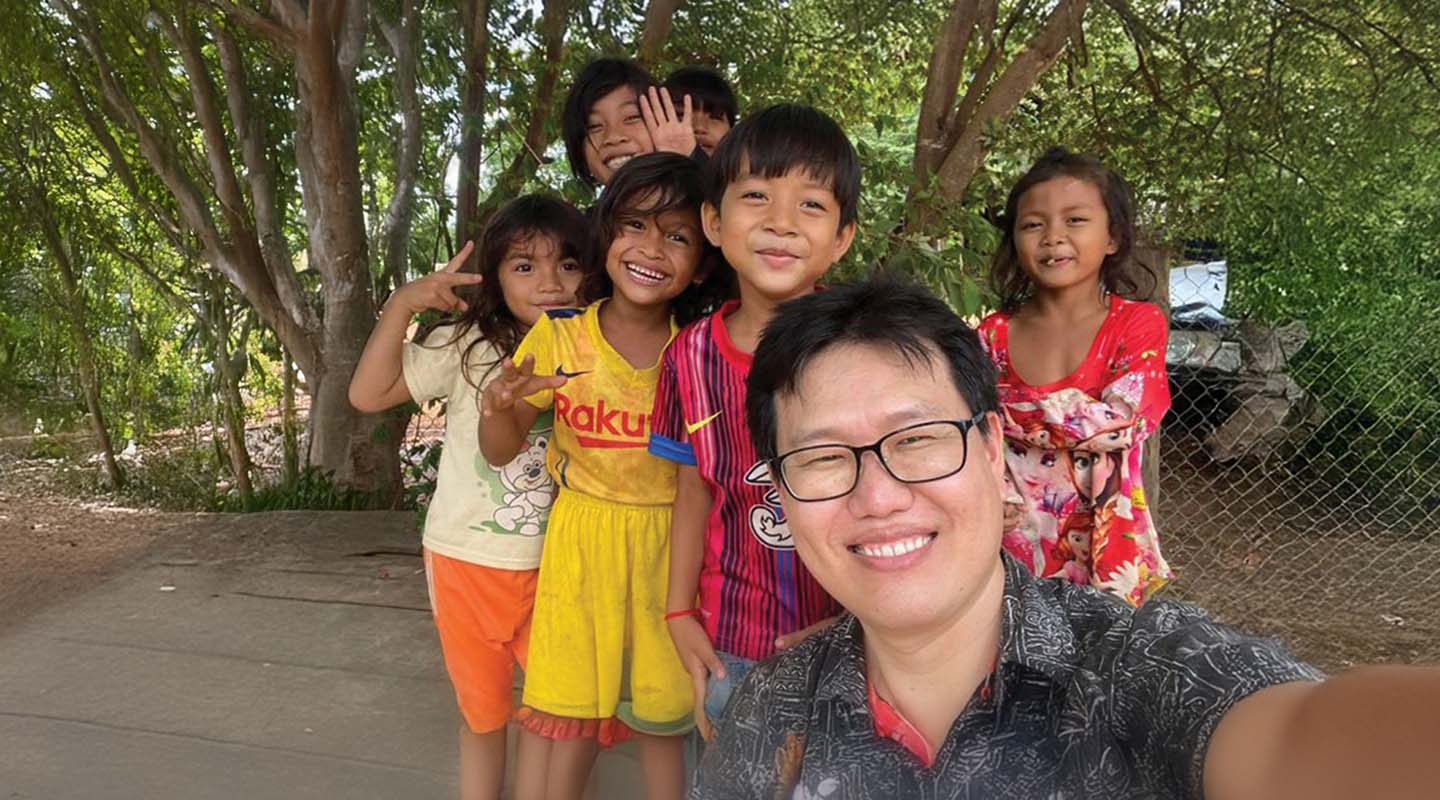 Former UMC Missionary Andrew Lee with participants in a children's ministry in Cambodia.