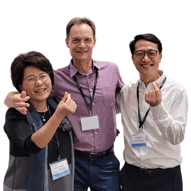 a group of three smiling missionaries