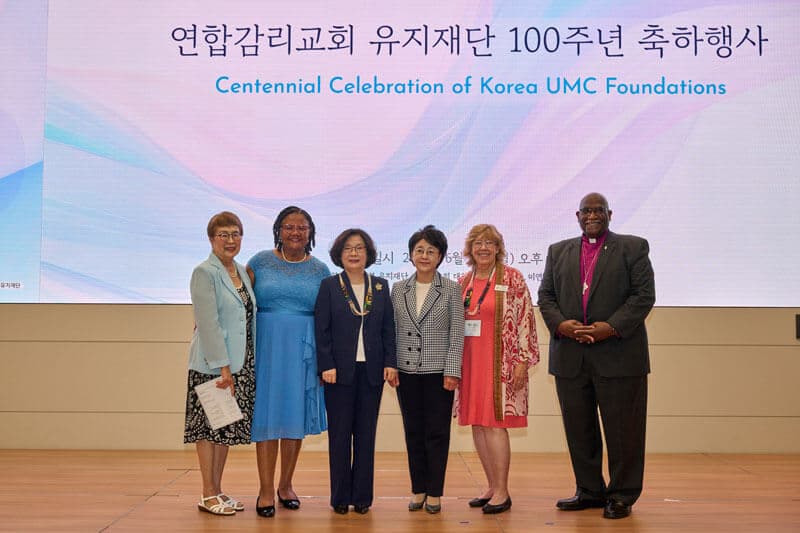 Leaders from The United Methodist Church and Ewha Womans University pose for a commemorative photo during the 100th anniversary celebration held at Ewha on June 30, 2025.